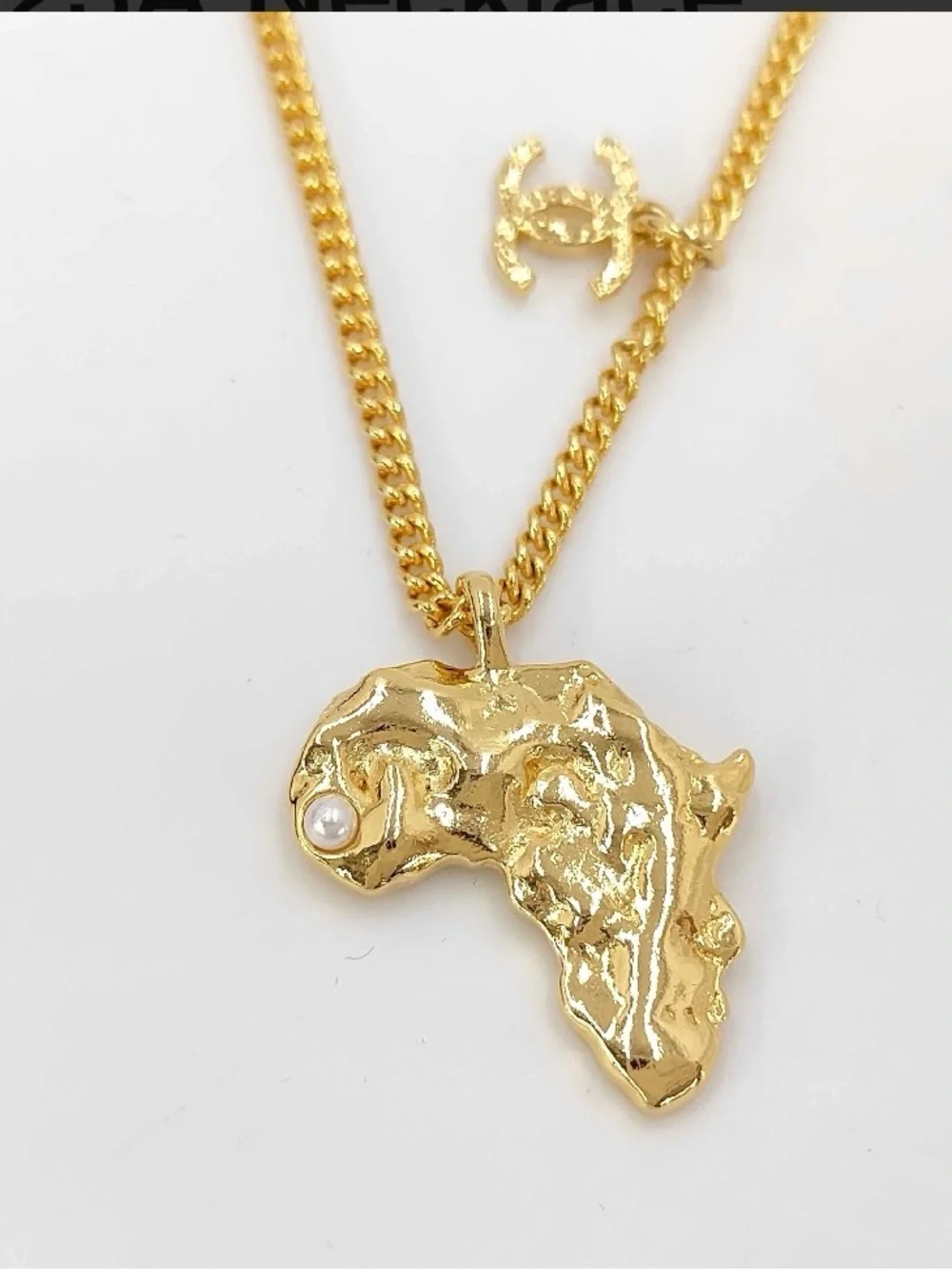 CHANEL Gold-Tone Africa Map Pendant Necklace with Pearl Detail